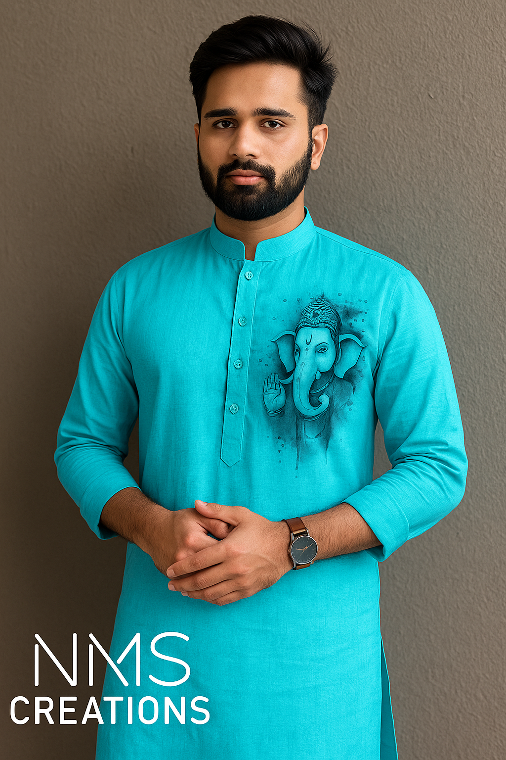 Man wearing a turquoise kurta with elephant design against a plain background, branded 'NMS Creations'.