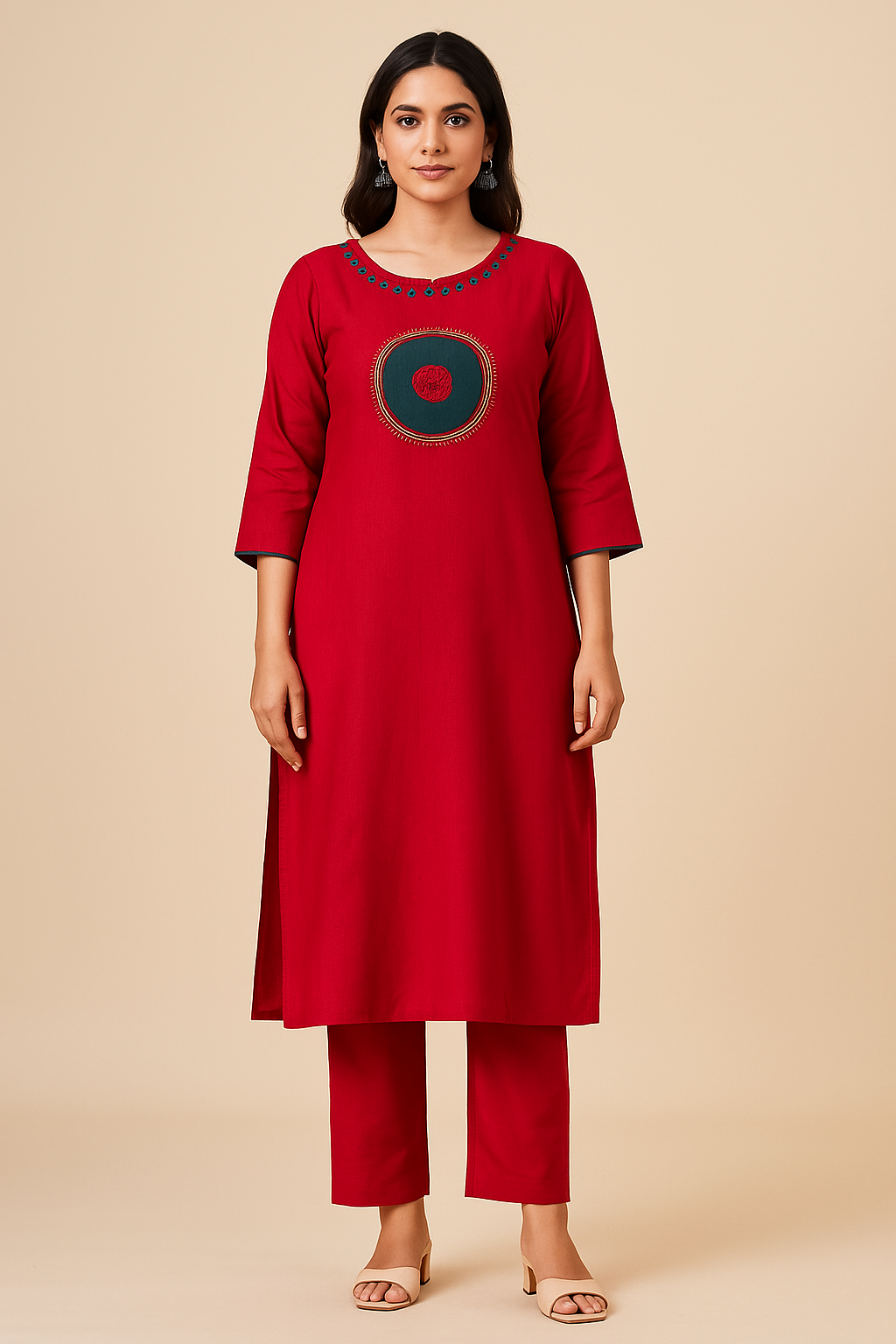 Woman wearing a red kurta with a circular design on a beige background