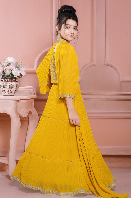 Woman wearing a yellow traditional outfit with a pink background