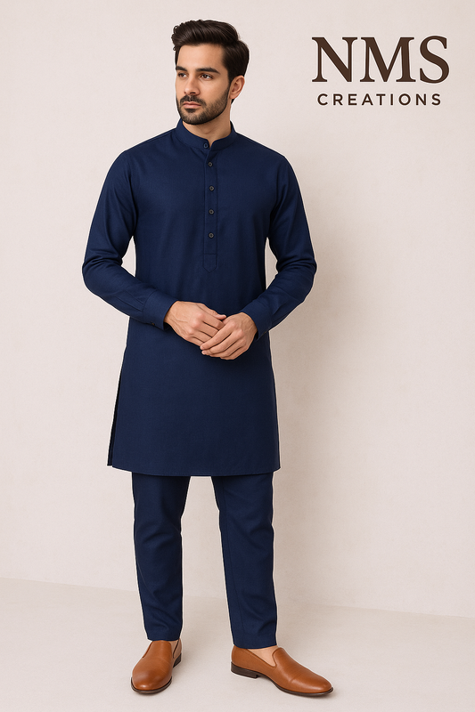 Man wearing a navy kurta with matching pants and brown shoes on a white background with 'NMS Creations' branding.