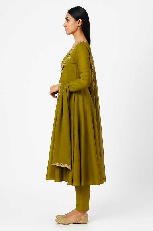 Woman wearing a green traditional outfit with a white background