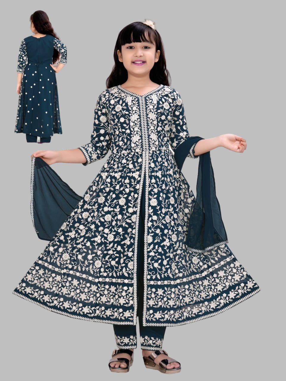 Girl wearing a traditional outfit with top, plazzo pant, and dupatta on a white background.