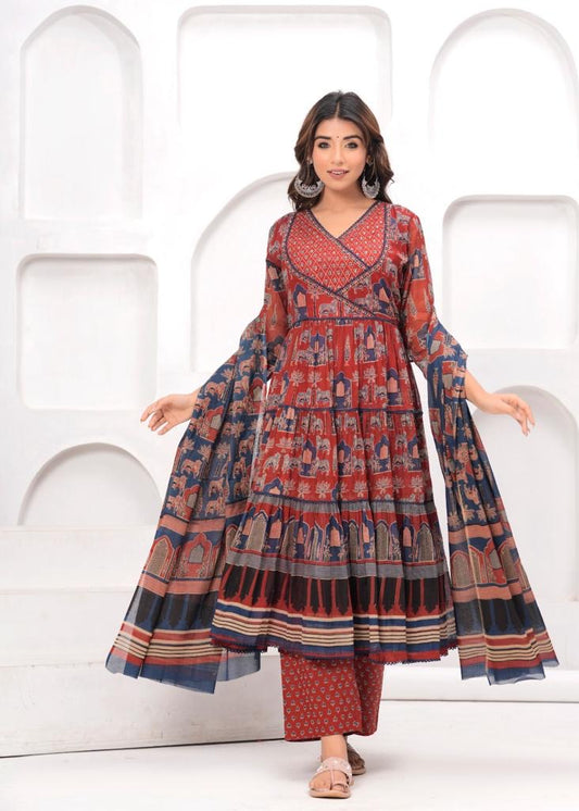 Woman wearing red printed ethnic kurta set with flared sleeves and wide-leg pants, festive attire