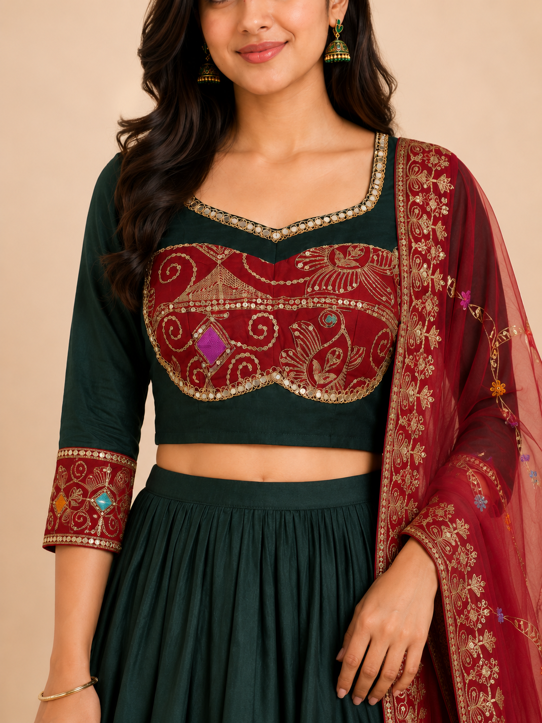 Close view of crimson embroidered blouse and shortened sleeve cuff