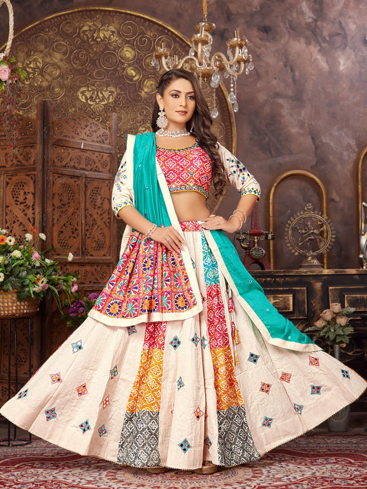 Woman wearing colorful embroidered lehenga choli with dupatta in elegant indoor setting