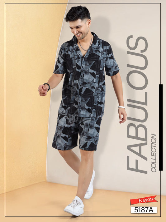 Man wearing modern black and gray abstract print rayon shirt and shorts set, white sneakers