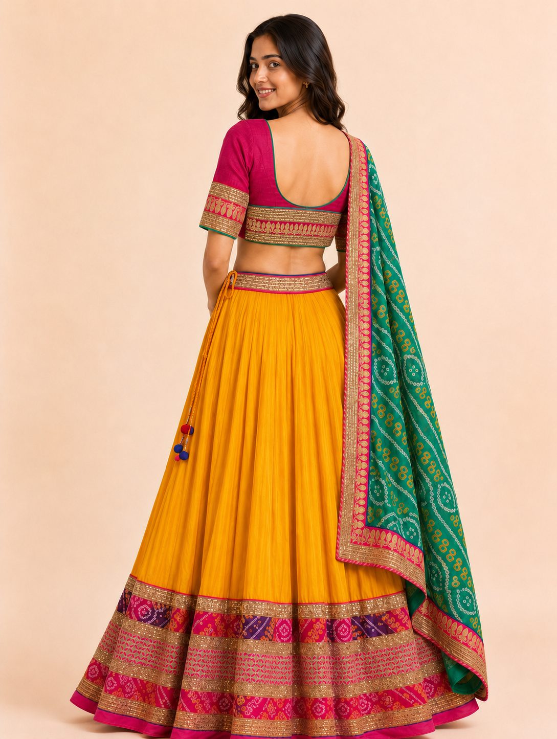 Mustard yellow Chaniya Choli back view showing deep U-back and embroidered lower-back blouse panel