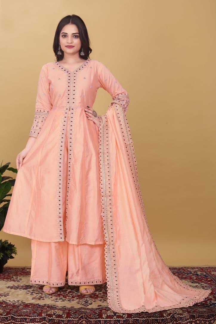 Woman in a peach embroidered kurta palazzo suit with dupatta, festive ethnic wear