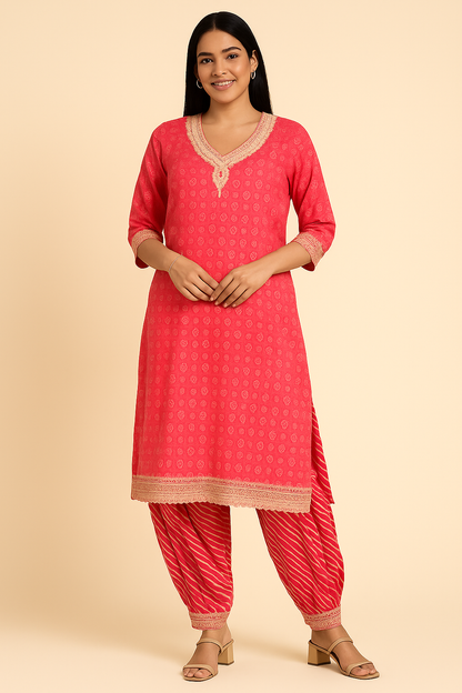 Woman wearing a red kurta with white patterns on a beige background