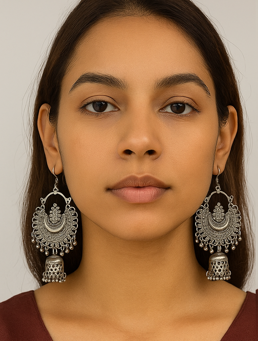 Side-by-side comparison of a woman wearing silver earrings against a neutral background