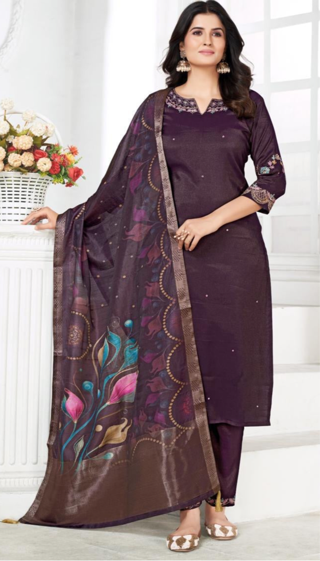 Woman in elegant purple salwar suit with floral printed dupatta, festive ethnic wear