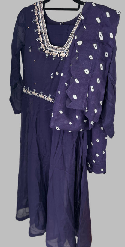 Purple embroidered festive kurta with matching dupatta on hanger