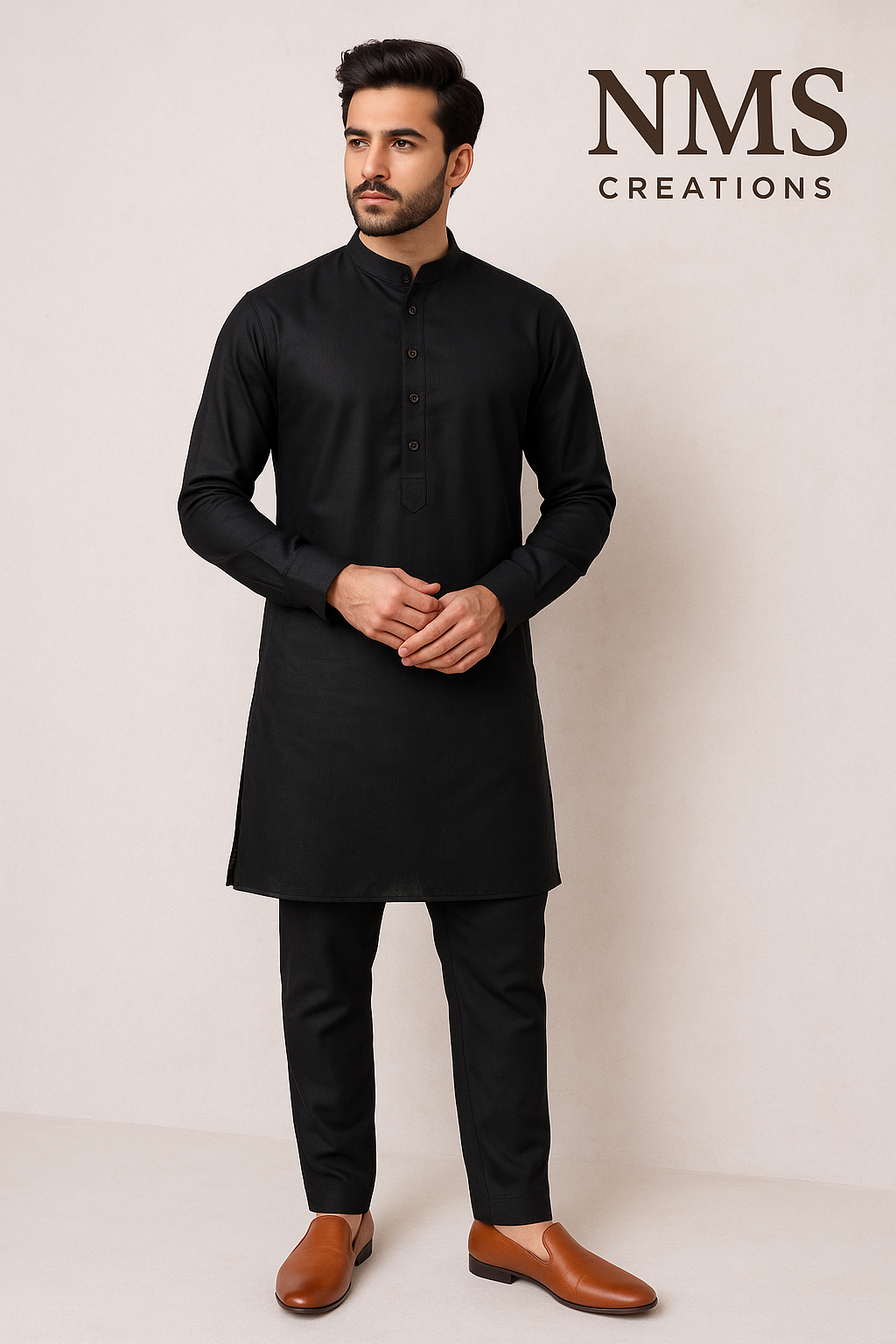 Man wearing a black kurta with brown shoes on a white background, branded 'NMS Creations'.