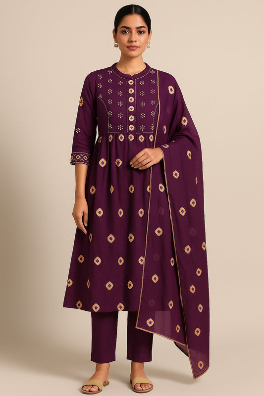 Woman wearing a purple traditional outfit with gold patterns on a beige background