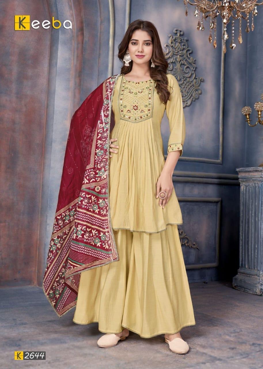 Woman wearing yellow embroidered kurta set with maroon printed dupatta, festive Indian outfit