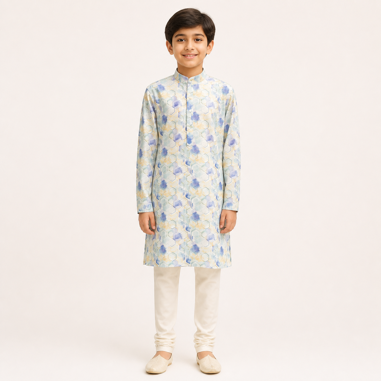 Boy model wearing a pastel blue printed kurta and white churidar set