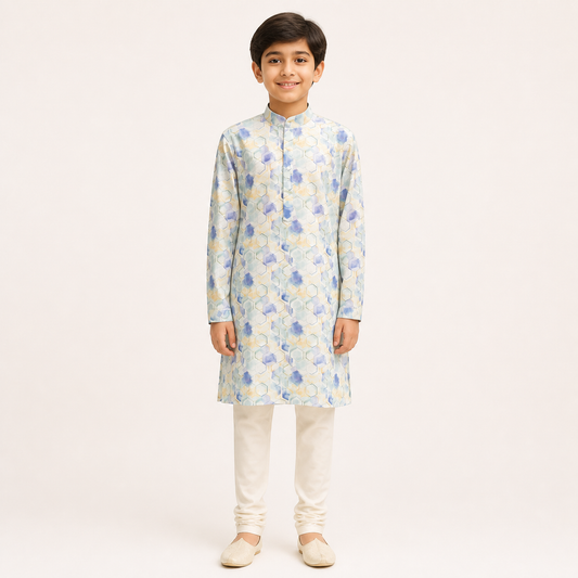 Boy model wearing a pastel blue printed kurta and white churidar set