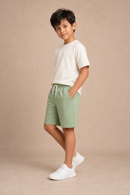 Three-quarter view of Pista Green premium cotton shorts