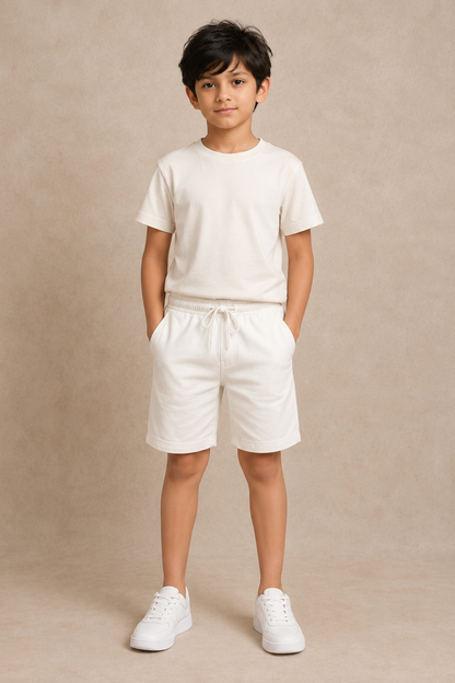Boy model wearing Classic White premium cotton shorts, front view