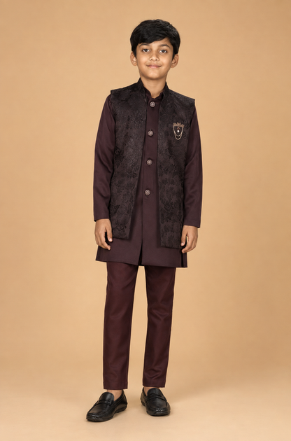 Boy model wearing the Wine Maroon three-piece kurta jacket set, front view
