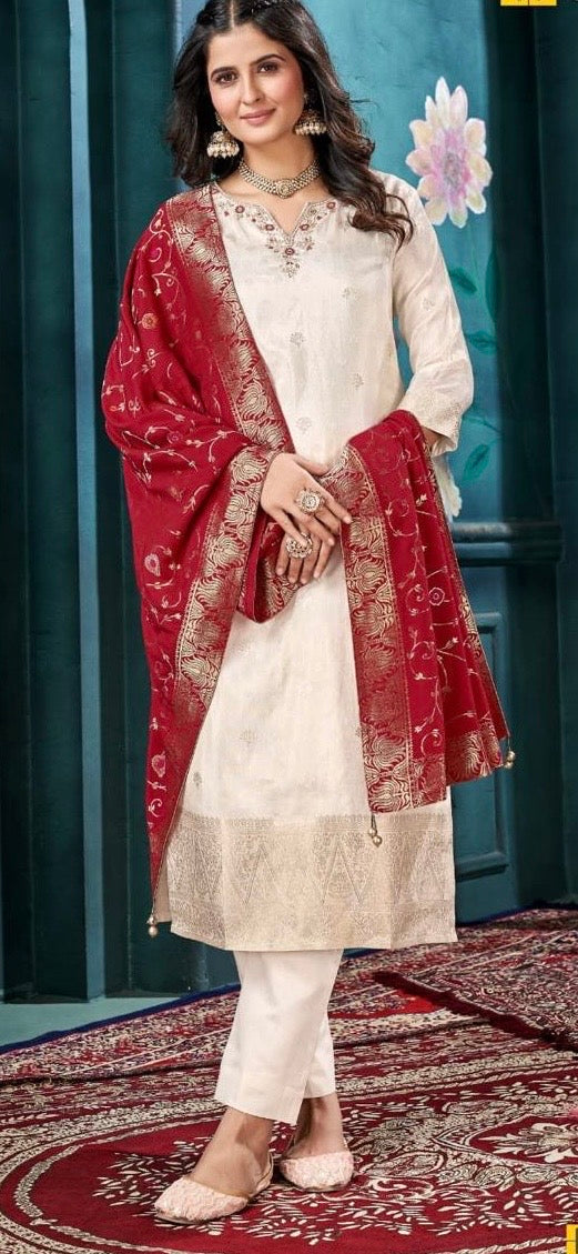 Woman in cream embroidered kurta set with red dupatta, festive ethnic wear fashion