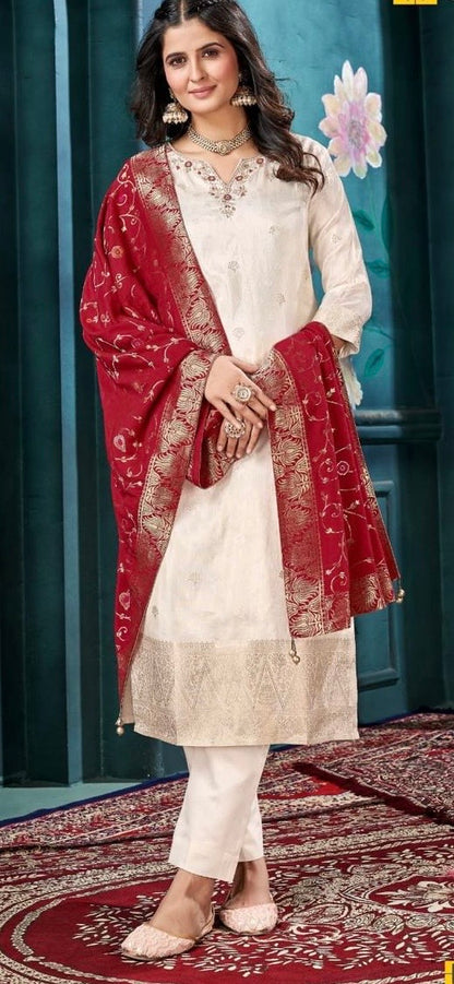 Woman in cream embroidered kurta set with red dupatta, festive ethnic wear fashion