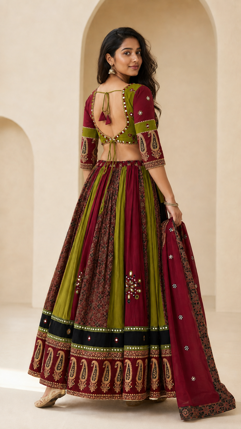 Back view showing the adjustable tie-back blouse and panelled lehenga