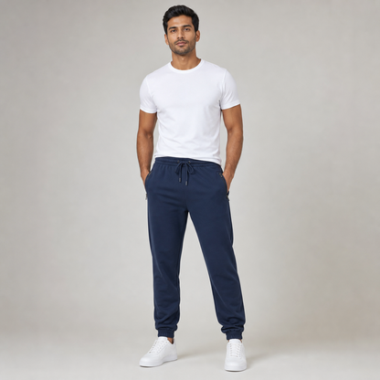 Man wearing navy blue French terry Go Relax joggers with zipped pockets