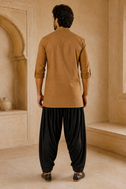 Men's black Patiala pants styled with camel kurta – back view