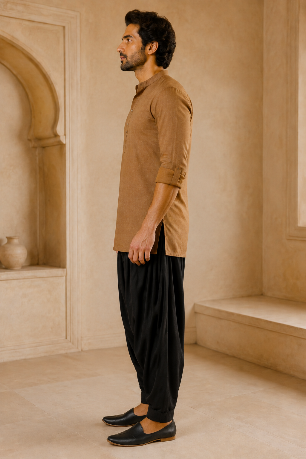 Men's black Patiala pants styled with camel kurta – side view