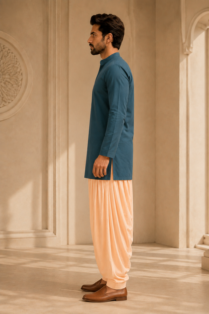 Men's peach pink Patiala pants styled with deep teal kurta – side view