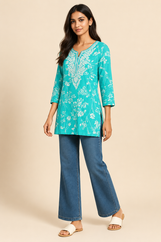 Aqua sky-blue floral embroidered cotton kurti styled with jeans – three-quarter view